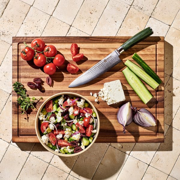 HexClad_LargeWalnutBoardV2_KWWB24-V2_ChefsKnife_CTCK08_GreekSalad_012325_KF_01.jpg Walnut Cutting Board. Large